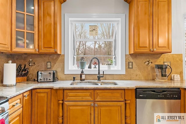 3 Eric Ct, Monroe, NJ 08831 - kitchen featuring stainless steel dishwasher, a sink, glass insert cabinets, light stone counters, and tasteful backsplash