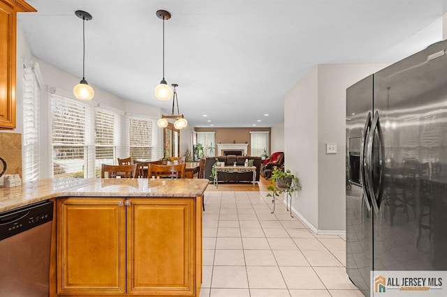3 Eric Ct, Monroe, NJ 08831 - kitchen with appliances with stainless steel finishes, light tile patterned flooring, decorative light fixtures, light stone counters, and a peninsula