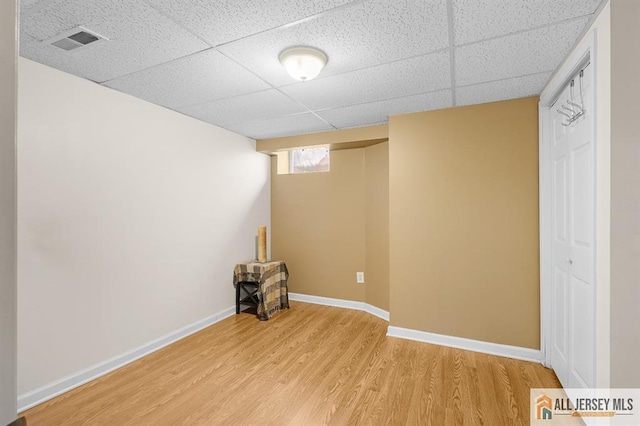 3 Eric Ct, Monroe, NJ 08831 - basement with light wood finished floors, a drop ceiling, and baseboards
