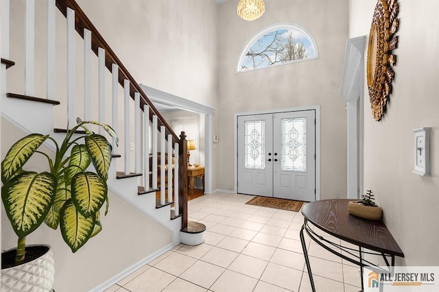 3 Eric Ct, Monroe, NJ 08831 - foyer entrance with stairway, light tile patterned floors, a high ceiling, french doors, and baseboards