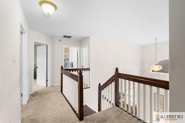 3 Eric Ct, Monroe, NJ 08831 - hallway with an upstairs landing, carpet flooring, and baseboards