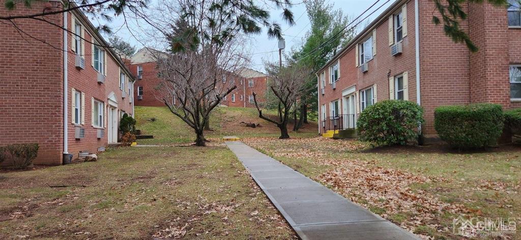 view of home's community featuring a yard