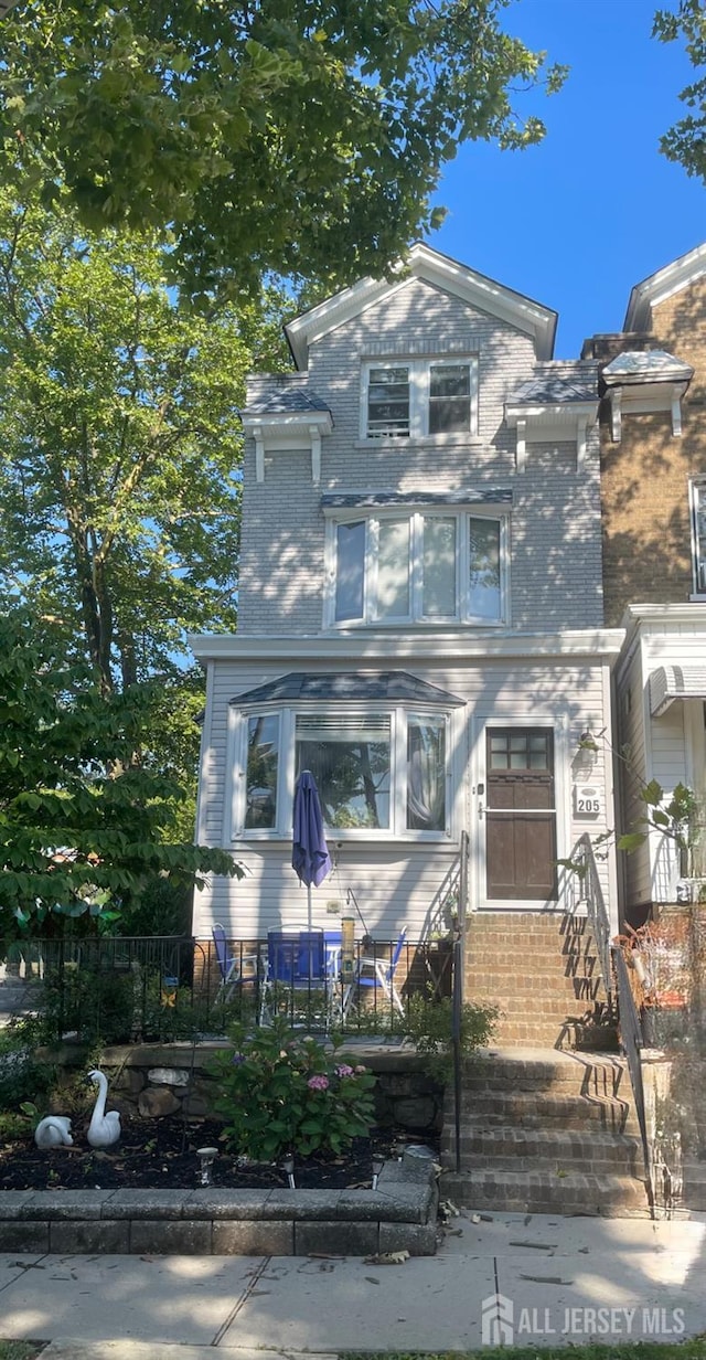 205 Water St, Perth Amboy, NJ 08861 - view of front facade with brick siding and entry steps