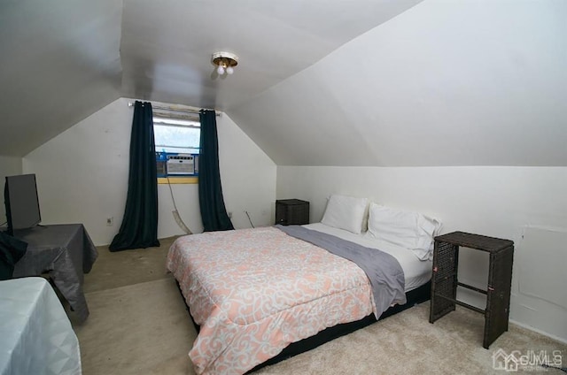 carpeted bedroom featuring lofted ceiling