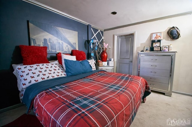 carpeted bedroom with baseboards and ornamental molding