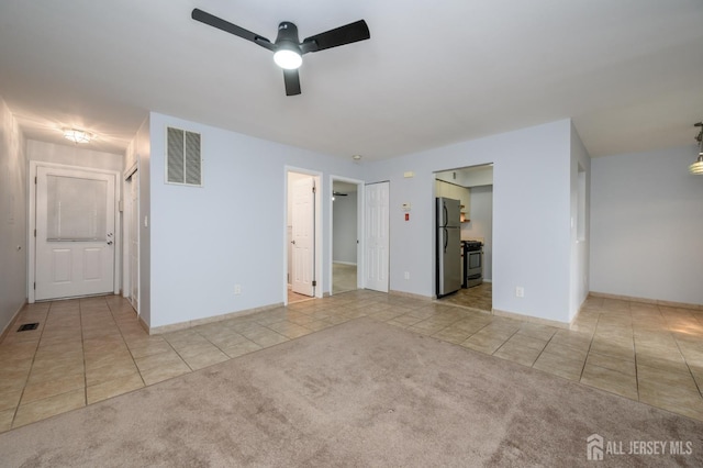 270 Main St Unit 6, Keansburg, NJ 07734 - unfurnished bedroom featuring tile patterned floors, freestanding refrigerator, and carpet