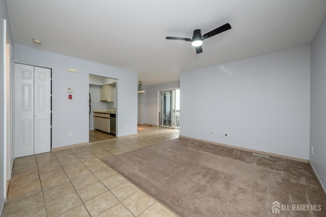 270 Main St Unit 6, Keansburg, NJ 07734 - empty room featuring ceiling fan, light tile patterned floors, a smoke detector, and a chandelier