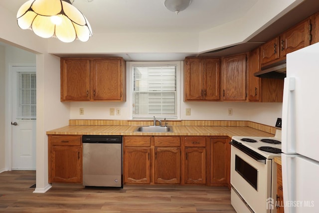 123-G Concordia Cir Unit G, Monroe, NJ 08831 - kitchen featuring white appliances, light wood-style floors, and brown cabinets