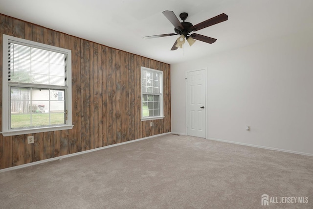 123-G Concordia Cir Unit G, Monroe, NJ 08831 - carpeted empty room featuring wood walls, plenty of natural light, and a ceiling fan