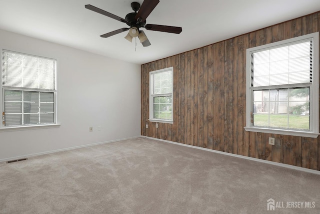 123-G Concordia Cir Unit G, Monroe, NJ 08831 - carpeted empty room featuring wood walls and ceiling fan