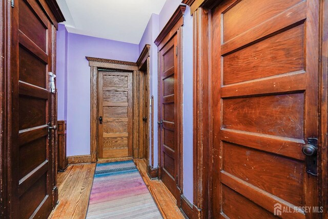 322 2nd St, Middlesex, NJ 08812 - doorway with light wood-style floors and baseboards