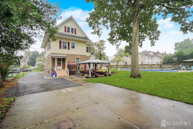 322 2nd St, Middlesex, NJ 08812 - rear view of house with a gazebo, a residential view, and a patio