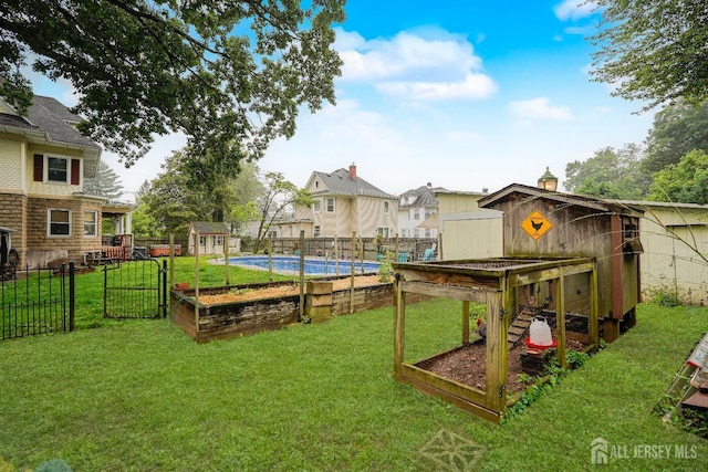 322 2nd St, Middlesex, NJ 08812 - fenced backyard featuring a storage unit and a residential view
