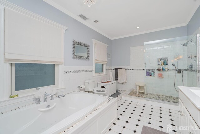 322 2nd St, Middlesex, NJ 08812 - bathroom featuring a shower stall, a garden tub, vanity, tile walls, and crown molding