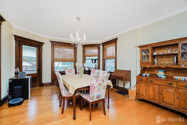 322 2nd St, Middlesex, NJ 08812 - dining space with a chandelier, light wood finished floors, and crown molding