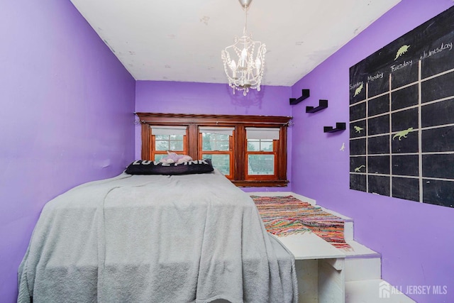 322 2nd St, Middlesex, NJ 08812 - bedroom featuring a chandelier
