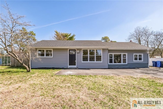 single story home featuring a patio area and a front yard