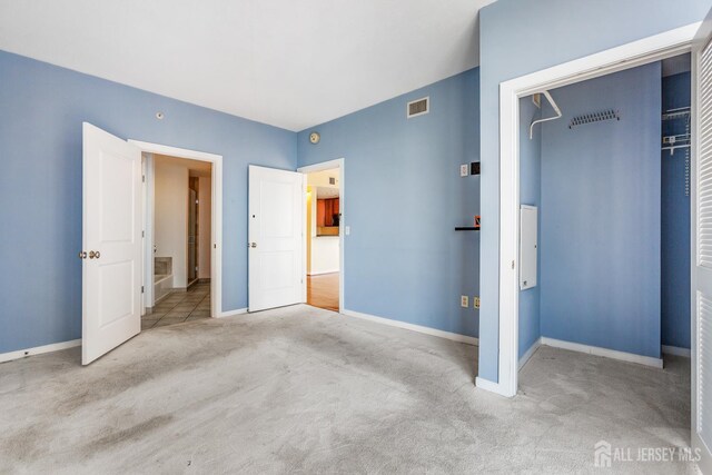 20 Livingston Ave Unit 902, New Brunswick, NJ 08901 - unfurnished bedroom featuring carpet flooring and a closet