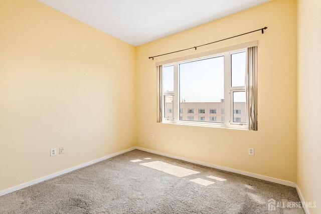 20 Livingston Ave Unit 902, New Brunswick, NJ 08901 - carpeted empty room with baseboards