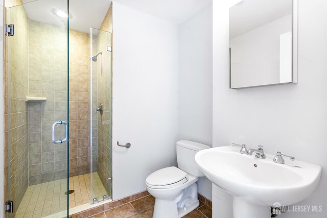 20 Livingston Ave Unit 902, New Brunswick, NJ 08901 - bathroom with a shower stall and tile patterned flooring