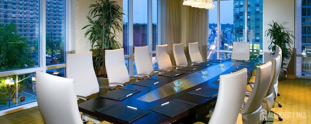 20 Livingston Ave Unit 902, New Brunswick, NJ 08901 - dining area featuring a city view and a chandelier
