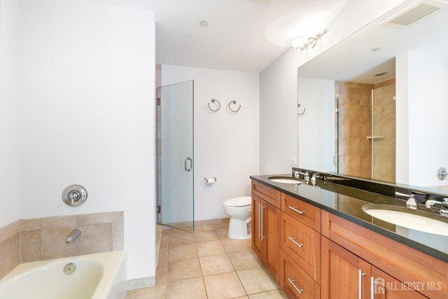 20 Livingston Ave Unit 902, New Brunswick, NJ 08901 - bathroom featuring double vanity, tile patterned floors, a garden tub, and an enclosed shower