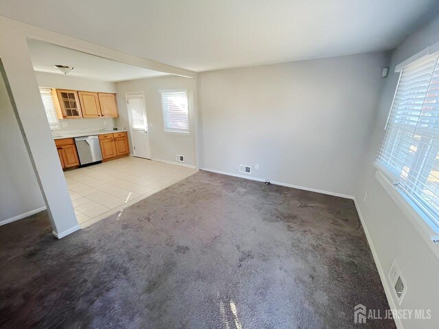 unfurnished living room with light carpet