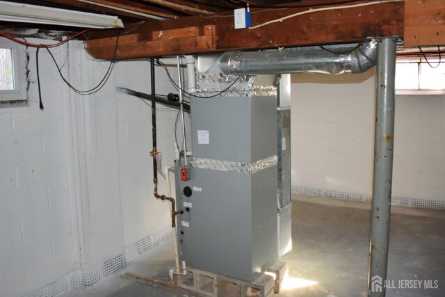 utility room with heating unit