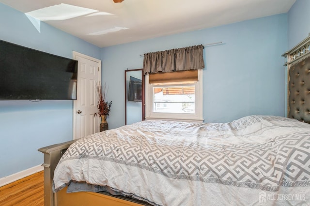 bedroom with wood finished floors