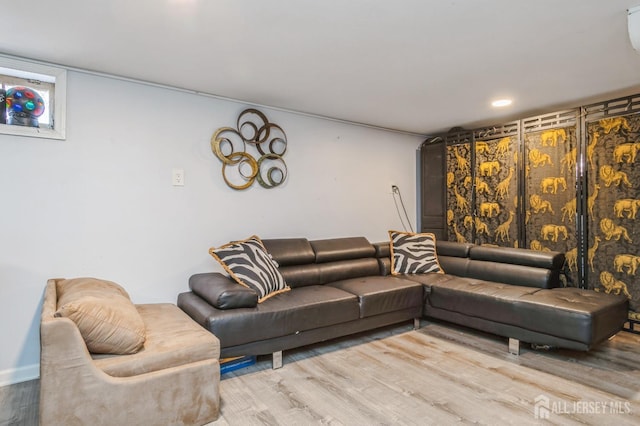 living room featuring recessed lighting and wood finished floors