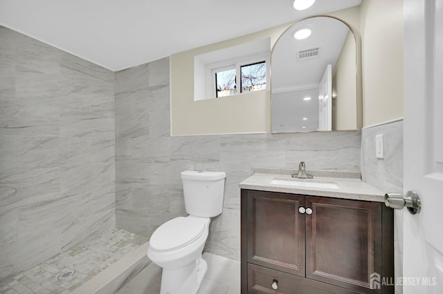 176 Easy St, Edison, NJ 08817 - full bathroom featuring tile walls, vanity, toilet, and a tile shower