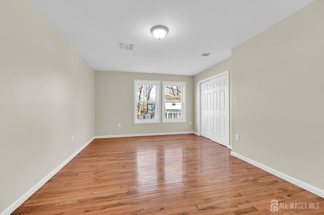 176 Easy St, Edison, NJ 08817 - unfurnished bedroom with light wood finished floors, baseboards, and a closet