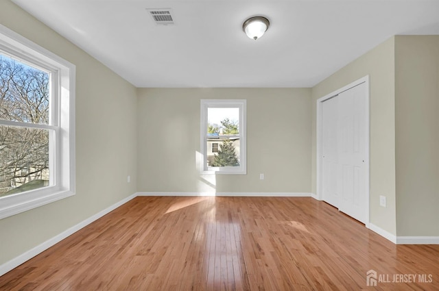 176 Easy St, Edison, NJ 08817 - unfurnished bedroom featuring light wood-type flooring, baseboards, and a closet