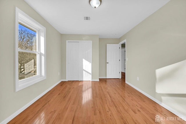 176 Easy St, Edison, NJ 08817 - unfurnished bedroom featuring light wood-style floors, baseboards, and a closet