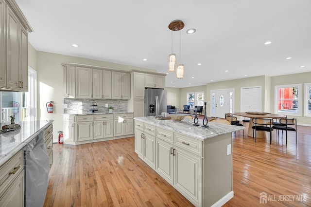 176 Easy St, Edison, NJ 08817 - kitchen featuring appliances with stainless steel finishes, light wood-style floors, decorative backsplash, a kitchen island, and recessed lighting