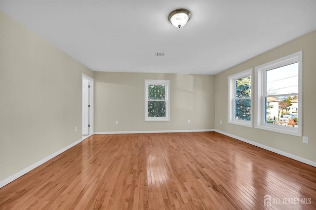 176 Easy St, Edison, NJ 08817 - empty room featuring light wood-type flooring, plenty of natural light, and baseboards