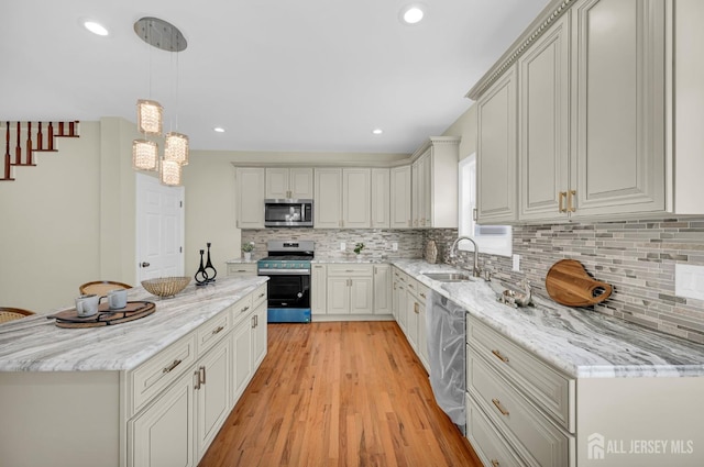 176 Easy St, Edison, NJ 08817 - kitchen with appliances with stainless steel finishes, a sink, decorative backsplash, a chandelier, and recessed lighting