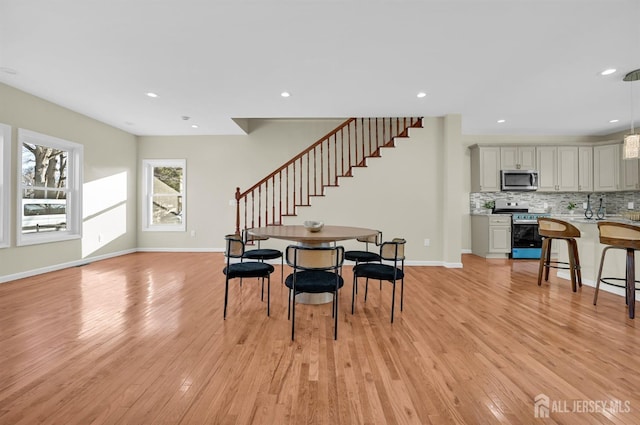 176 Easy St, Edison, NJ 08817 - dining space featuring stairs, light wood-type flooring, recessed lighting, and baseboards