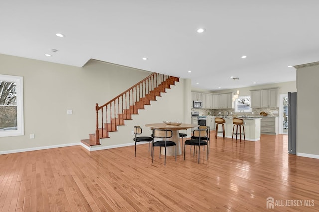 176 Easy St, Edison, NJ 08817 - dining room with stairs, light wood-type flooring, recessed lighting, and baseboards