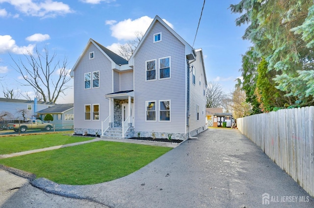 front facade with a front yard