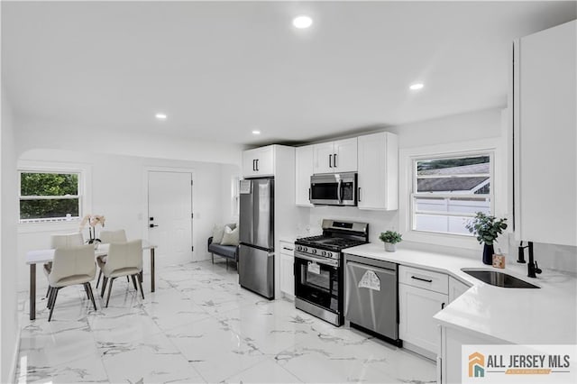 99 Crestview Rd, Fords, NJ 08863 - kitchen with appliances with stainless steel finishes, a sink, recessed lighting, white cabinets, and light countertops