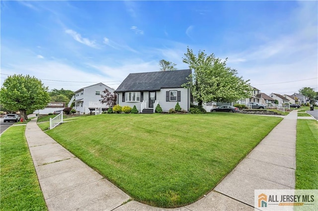 99 Crestview Rd, Fords, NJ 08863 - view of front of home with a front lawn, roof with shingles, a residential view, and entry steps
