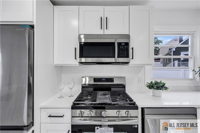 99 Crestview Rd, Fords, NJ 08863 - kitchen with appliances with stainless steel finishes, light countertops, white cabinetry, and backsplash