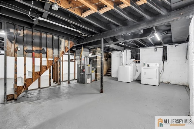 99 Crestview Rd, Fords, NJ 08863 - unfinished below grade area featuring separate washer and dryer, stairs, and heating unit