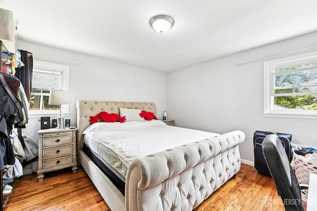 16 Kerschner Ln, East Brunswick, NJ 08816 - bedroom with multiple windows and wood finished floors