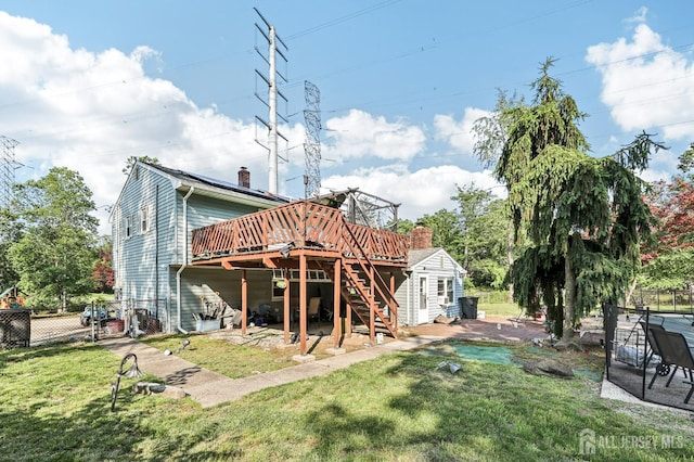 16 Kerschner Ln, East Brunswick, NJ 08816 - rear view of property featuring a wooden deck, stairway, and a chimney