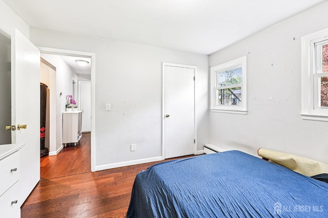 16 Kerschner Ln, East Brunswick, NJ 08816 - bedroom with dark wood-style flooring and a baseboard radiator