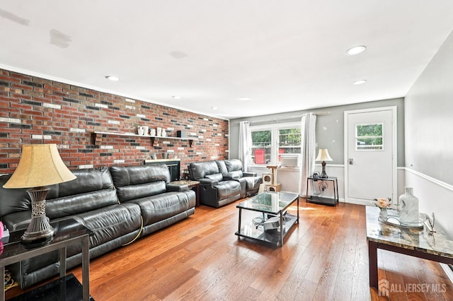 16 Kerschner Ln, East Brunswick, NJ 08816 - living area featuring hardwood / wood-style flooring, brick wall, and recessed lighting