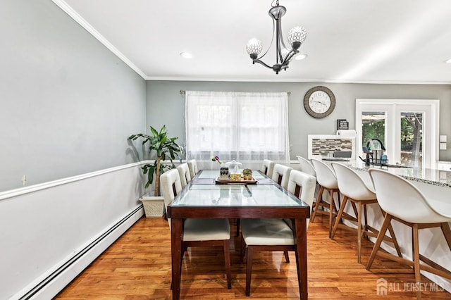 16 Kerschner Ln, East Brunswick, NJ 08816 - dining area featuring a baseboard heating unit, crown molding, light wood-style flooring, a chandelier, and recessed lighting
