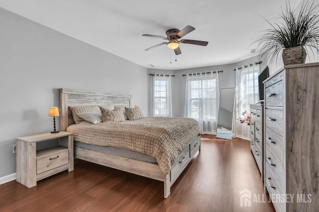 904 4th St, Union Beach, NJ 07735 - bedroom featuring dark wood-type flooring, baseboards, and ceiling fan